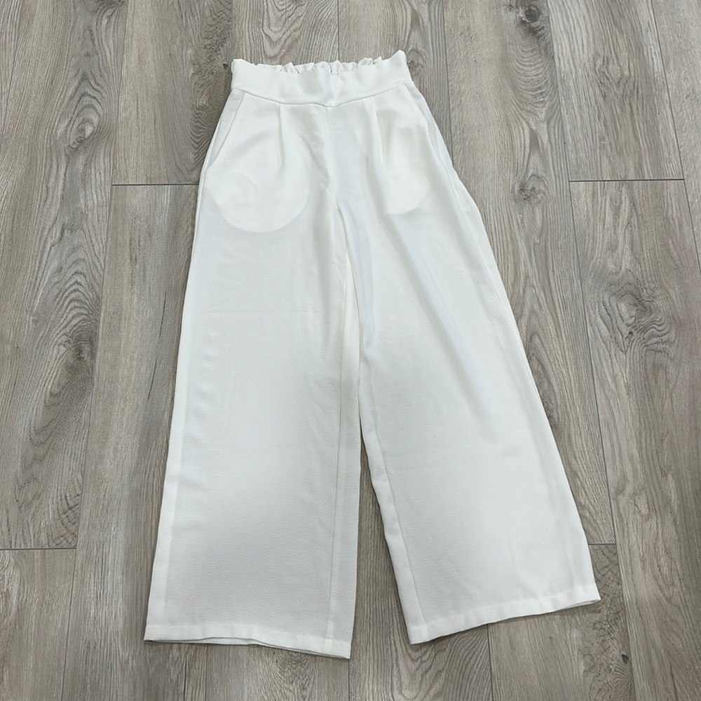 Wide legged white pants. Never worn.